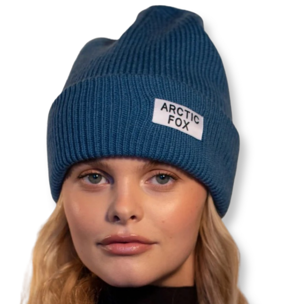 Recycled blue beanie hat eco friendly and sustainable shown on a model with Arctic Fox branding