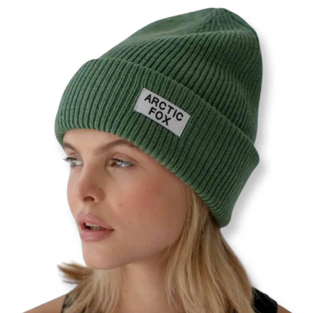 Recycled green beanie hat eco friendly and sustainable shown on a model with Arctic Fox branding
