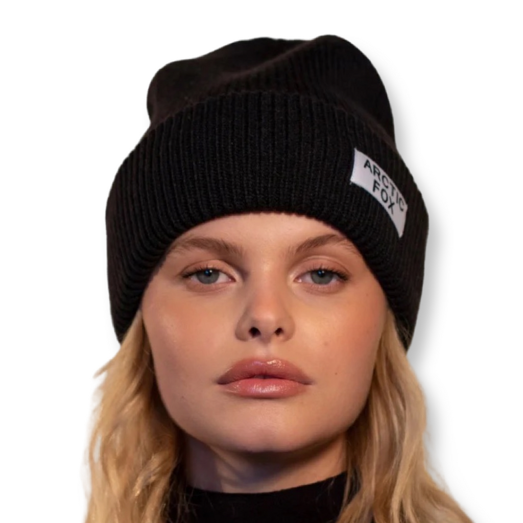 Recycled black beanie hat eco friendly and sustainable shown on a model with Arctic Fox branding